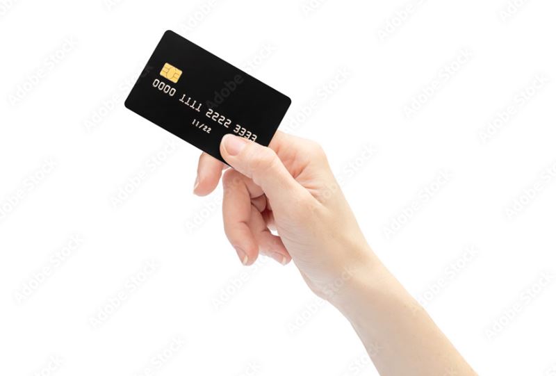 Woman holding Debit Card